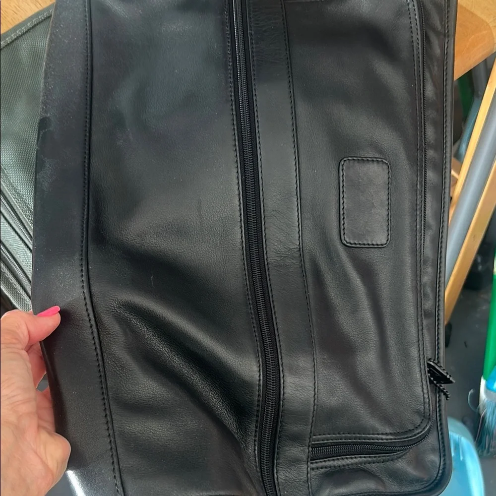 Tumi black leather bag